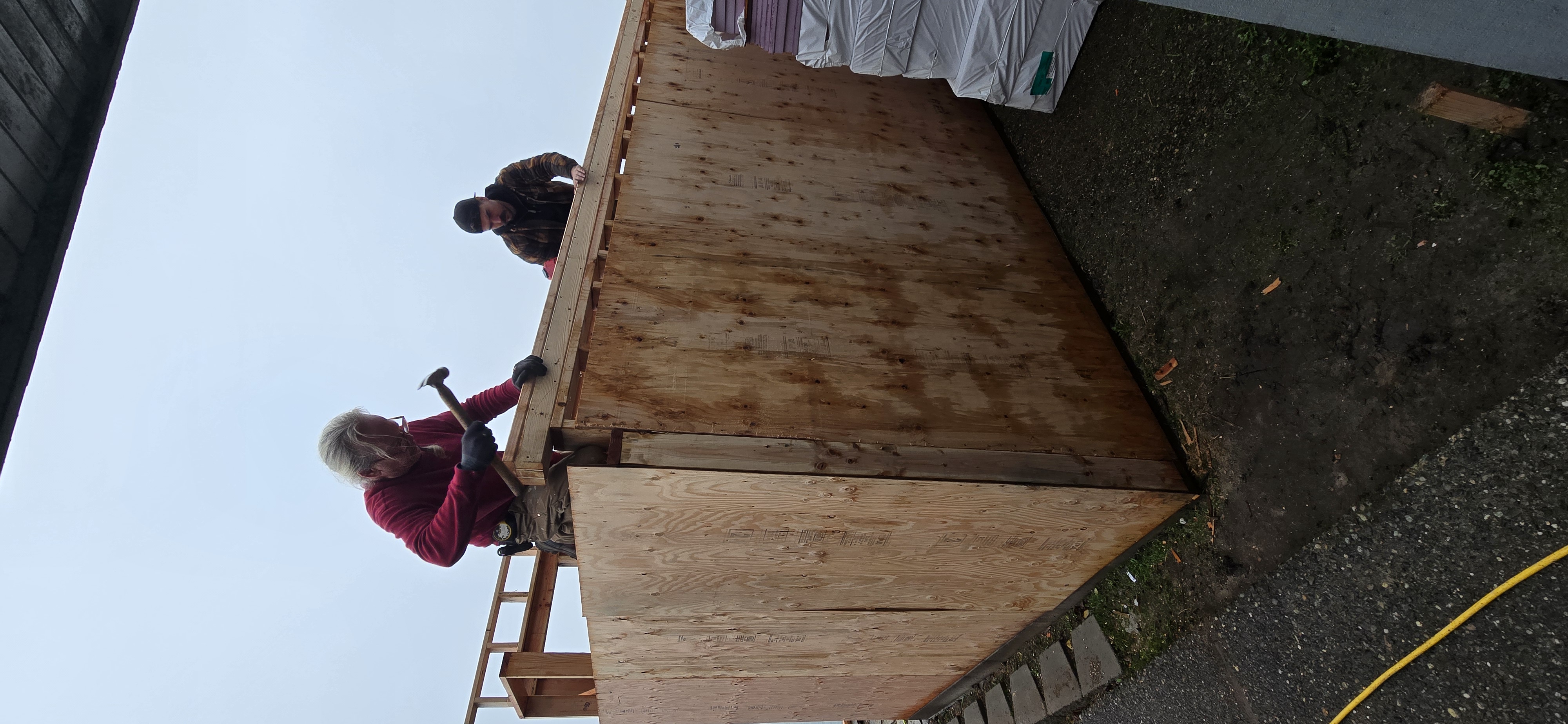 Bell & Hammer crew working on exterior siding