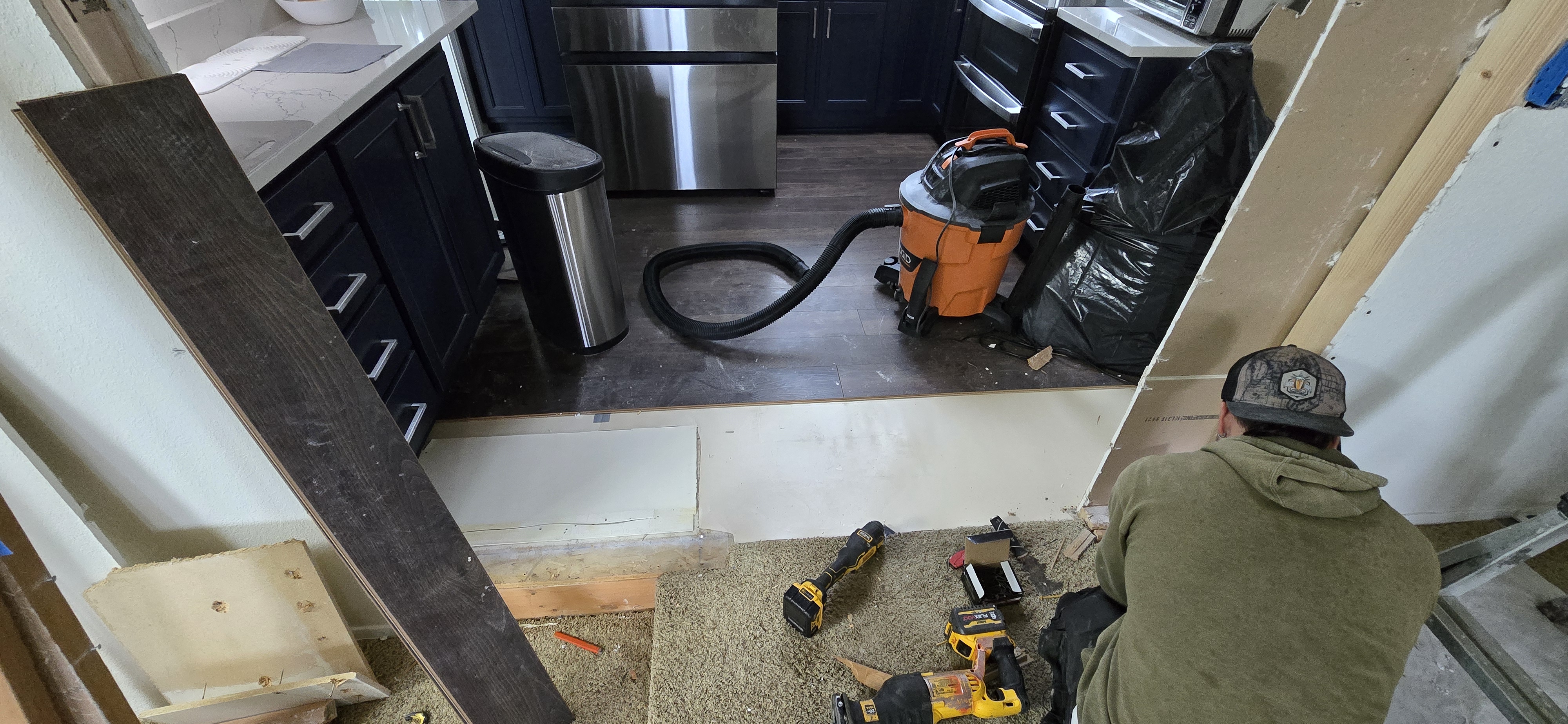Bell & Hammer worker framing a wall opening during a kitchen remodel