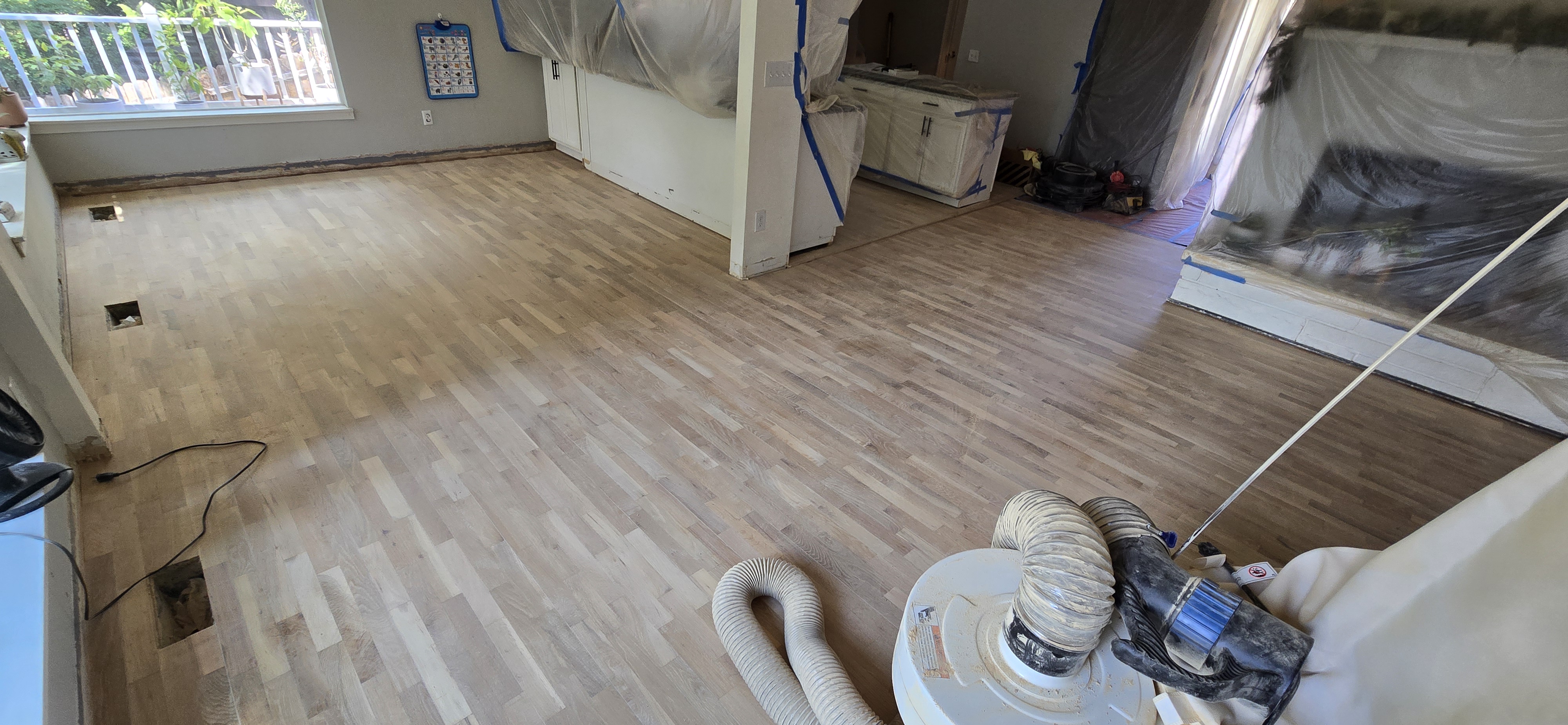 Hardwood floor refinishing in progress