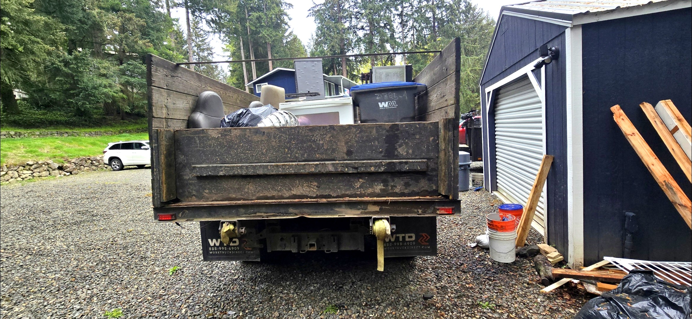 Dump bed loaded with junk removal items