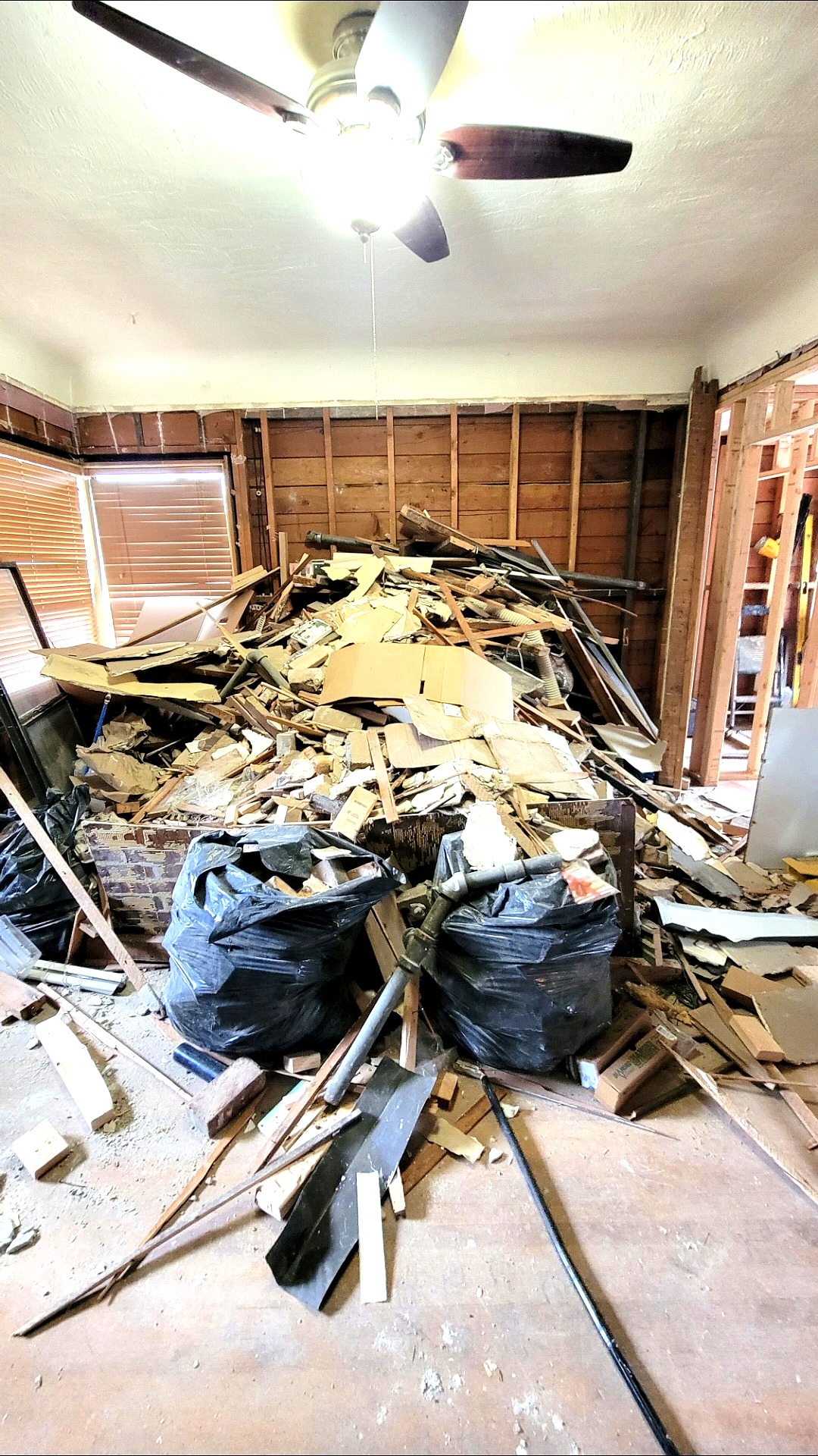 Room full of demolition debris before hauling