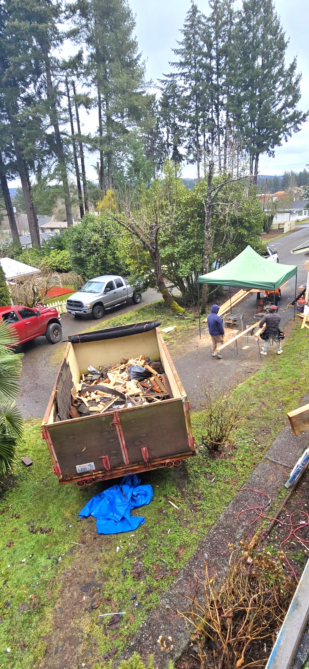 Overhead view of Bell & Hammer crew loading demo debris into trailer