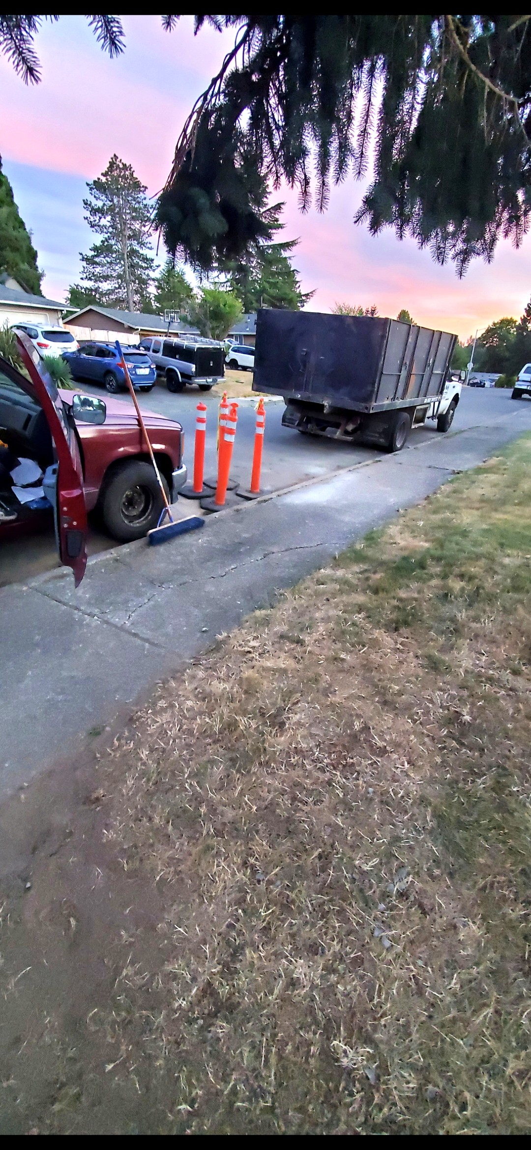 Bell & Hammer dump truck at sunset with safety cones