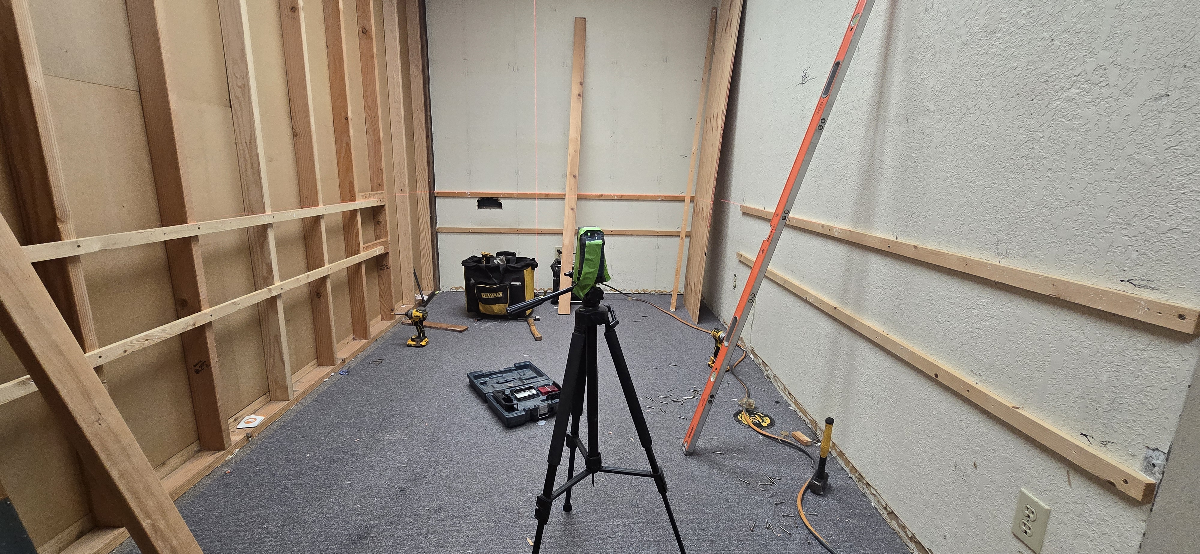 Interior wall framing with laser level and tools